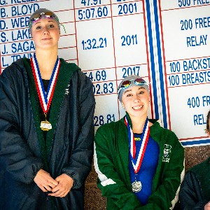 Swimmers wearing medals